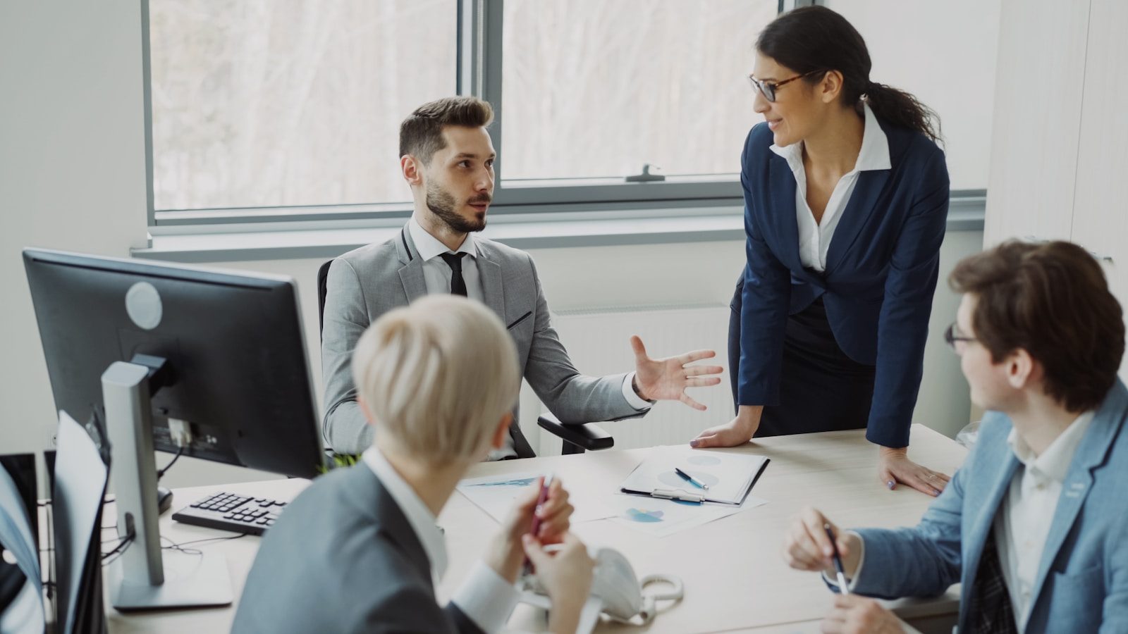 Business professionals collaborating in a modern office meeting